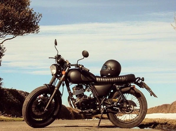Motorcycle and helmet in the sun